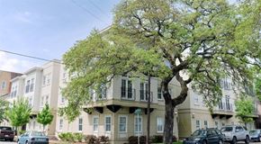 Savannah apartment for rent - a large apartment building with cars parked in front of it