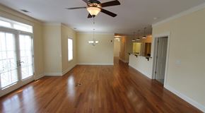 Savannah apartment for rent - an empty living room with a ceiling fan