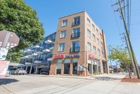 Charlotte apartment for rent - a building on the corner of a street with a stop sign