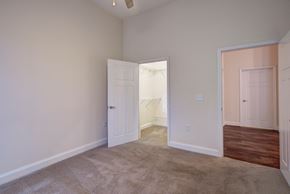 Charlotte apartment for rent - a bedroom with an open door and a carpeted floor