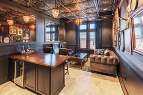 Savannah apartment for rent - a conference room with a leather couch and a wooden desk