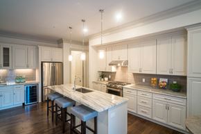 Charlotte apartment for rent - a large kitchen with white cabinets and a marble counter top