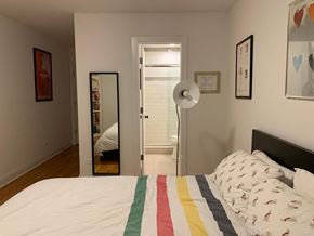 Chicago apartment for rent - a bedroom with a bed and a door to a bathroom