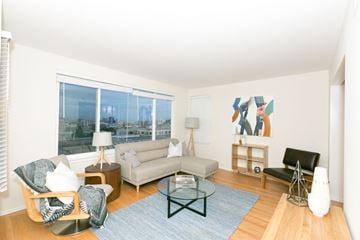 San Francisco apartment for rent - A living room with a couch, chair, and a table.