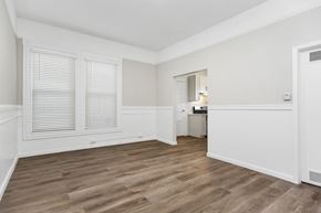 San Francisco apartment for rent - A room with wooden floors and white walls.