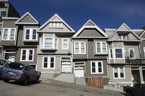San Francisco apartment for rent - A row of townhouses with cars parked in front.