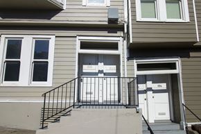 San Francisco apartment for rent - A house with a white door and a black railing.
