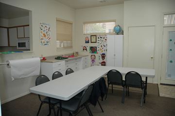 Hawthorne apartment for rent - a dining room with a white table and chairs