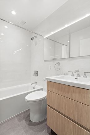 New York apartment for rent - a bathroom with a toilet and a sink