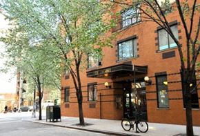 New York apartment for rent - a brick building with a bike parked outside of it