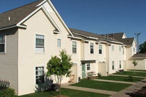 Columbia Heights apartment for rent - a row of houses with white siding and green grass