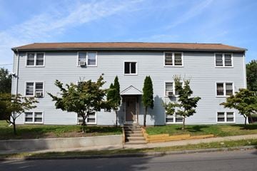 New Haven apartment for rent - A grey house with a brown roof and a front door.