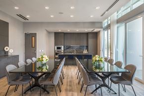 Los Angeles apartment for rent - A modern dining room with a glass table and chairs.