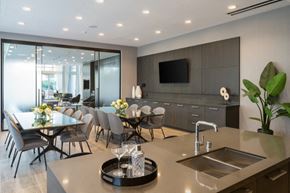 Los Angeles apartment for rent - A modern kitchen with a dining table set for two.