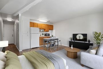 Denver apartment for rent - A modern living room with a grey couch and a wooden coffee table.