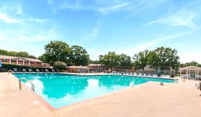 Huntsville apartment for rent - A large swimming pool with a blue tinted water and a red line on the side.