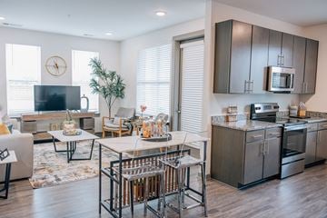 Madison apartment for rent - A modern kitchen with a dining table and chairs.