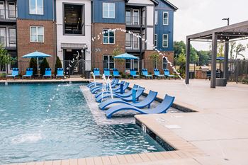 Resort-style saltwater pool with sundeck and in-water tanning ledge
