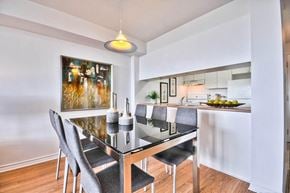 Ottawa apartment for rent - an open kitchen and dining room with a table and chairs