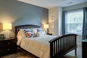 Baltimore apartment for rent - a bedroom with a bed and a crib and a window