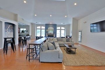 Baltimore apartment for rent - a large living room with a couch and a bar