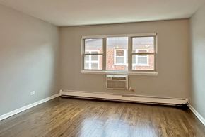 Oak Park apartment for rent - A room with a window and a radiator on the floor.