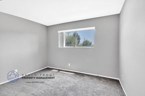 Brea apartment for rent - the master bedroom has a large window and a carpeted floor