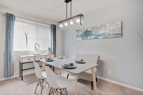 Alexandria apartment for rent - a dining room with a table and chairs and a window