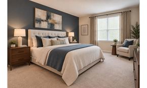 Alexandria apartment for rent - A bedroom with a large bed and a chair.