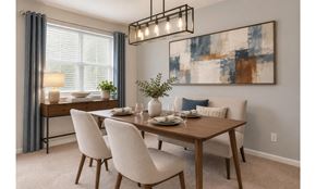 Alexandria apartment for rent - A dining room with a wooden table and white chairs.