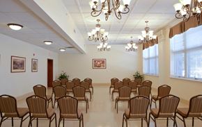 Albion apartment for rent - an empty conference room with chairs and chandeliers