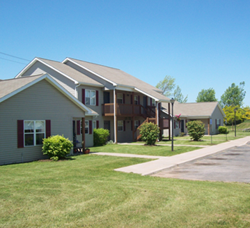 Albion apartment for rent - A row of houses with green lawns in front.