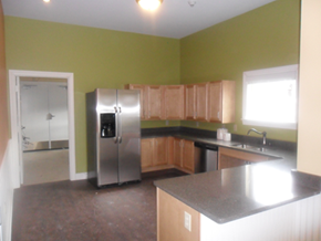 S. Glens Falls townhouse for rent - a kitchen with green walls and a stainless steel refrigerator