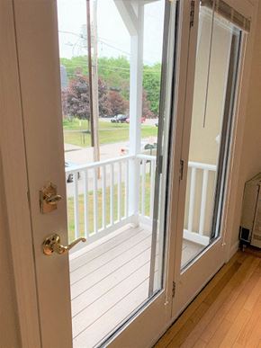 South Portland apartment for rent - A white door with a glass window is open.