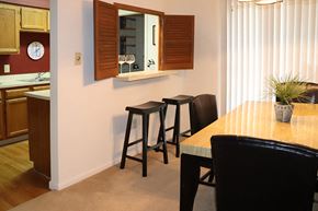 Harrisburg apartment for rent - a dining room and kitchen with a table and stools