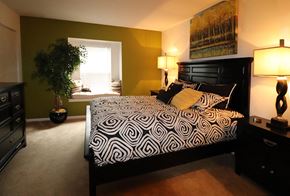 Harrisburg apartment for rent - a bedroom with a large bed and a window