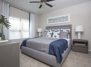 Lake Charles apartment for rent - a bedroom with a bed and a ceiling fan
