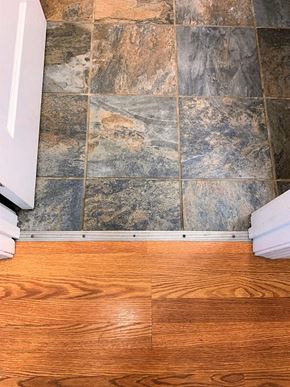 South Portland apartment for rent - A bathroom with a wooden floor and stone tiles.