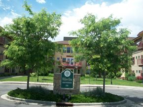 Lakewood apartment for rent - A sign for Willow Glen Senior Living is in front of a building with trees.