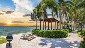 Tampa apartment for rent - a picnic table and a gazebo on the beach at sunset