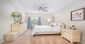 Centreville apartment for rent - A bedroom with a bed, dresser, and nightstand.