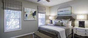 Atlanta apartment for rent - an example of a bedroom with a bed and a window