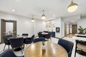 Atlanta apartment for rent - A dining room with a round table and chairs.