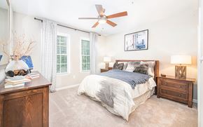 Atlanta apartment for rent - a bedroom with a large bed and a ceiling fan