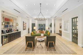 Atlanta apartment for rent - A dining room with a table set for two and a kitchen area in the background.