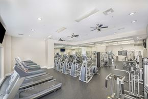 Atlanta apartment for rent - A spacious gym with treadmills, elliptical machines, and other exercise equipment.