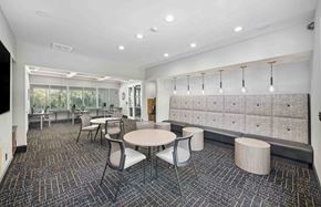 Atlanta apartment for rent - a dining room with tables and chairs in a lobby