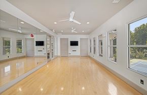 Atlanta apartment for rent - a large living room with a wood floor and large windows