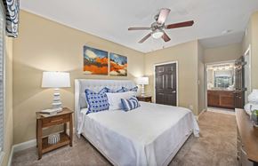 Atlanta apartment for rent - a bedroom with a large bed and a ceiling fan