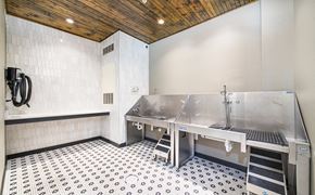 Atlanta apartment for rent - a commercial kitchen with stainless steel appliances and a sink